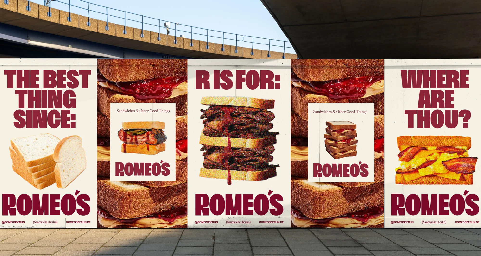 Outdoor advertising panel showcasing stacked sandwiches and related imagery for Romeo's Sandwiches on a sunny day.