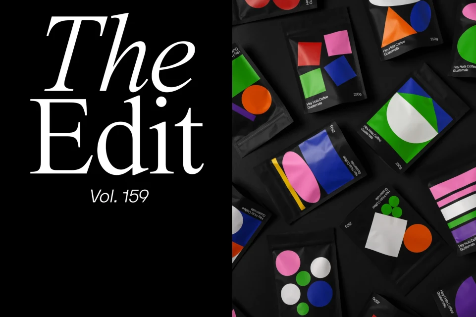 Arrangement of black coffee bags with geometric shapes, contrasting with white text on black background promoting 'The Edit Vol. 159'.