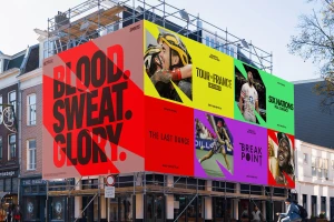 Large colourful Netflix brand identity billboard mounted on scaffolding over a European city street