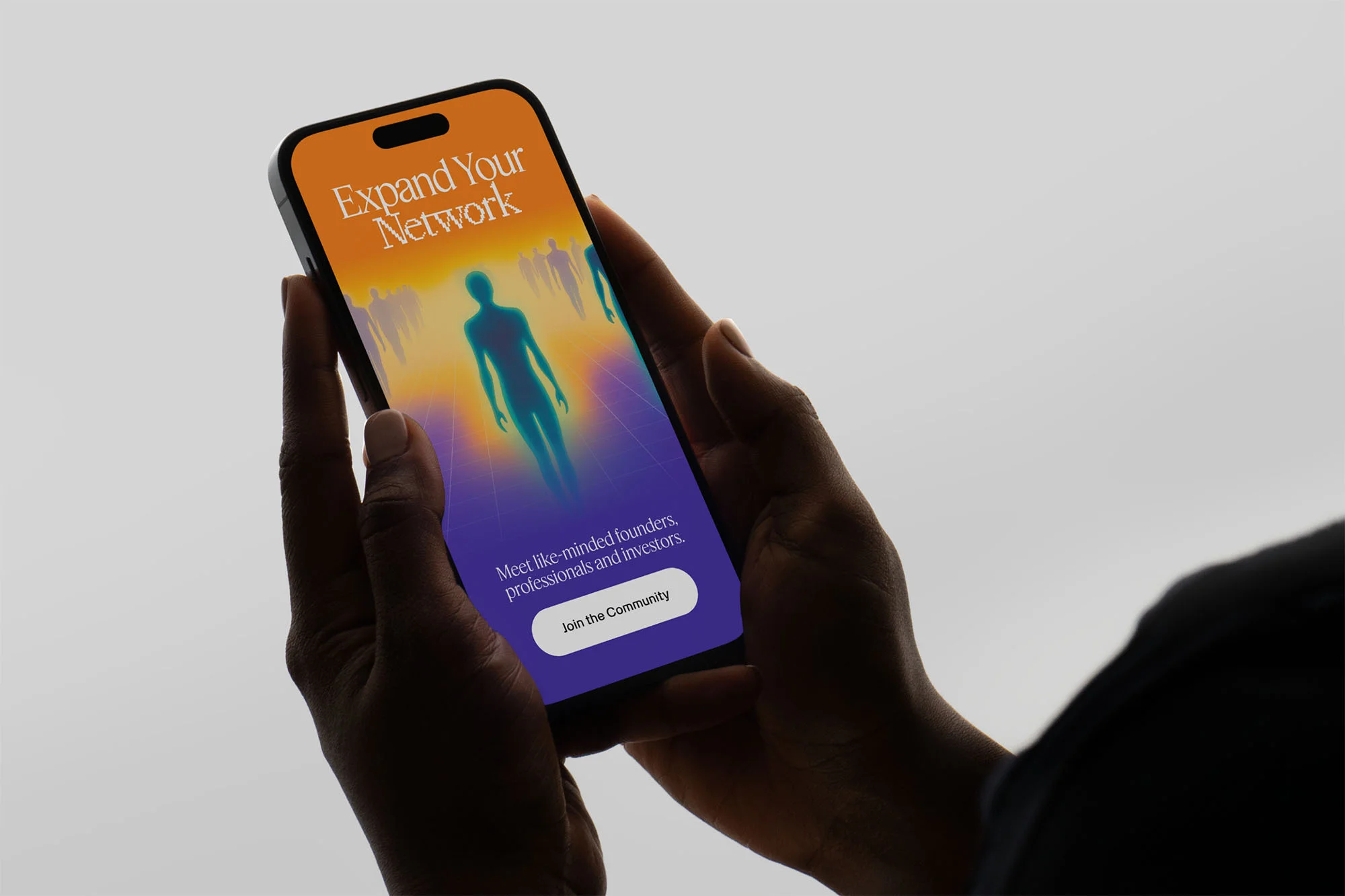Hands holding a phone displaying a network app interface with a silhouette figure and text 'Expand Your Network' against a light background.