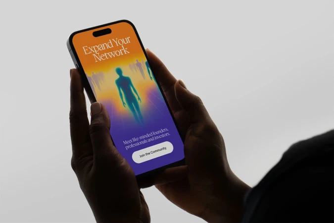 Hands holding a phone displaying a network app interface with a silhouette figure and text 'Expand Your Network' against a light background.