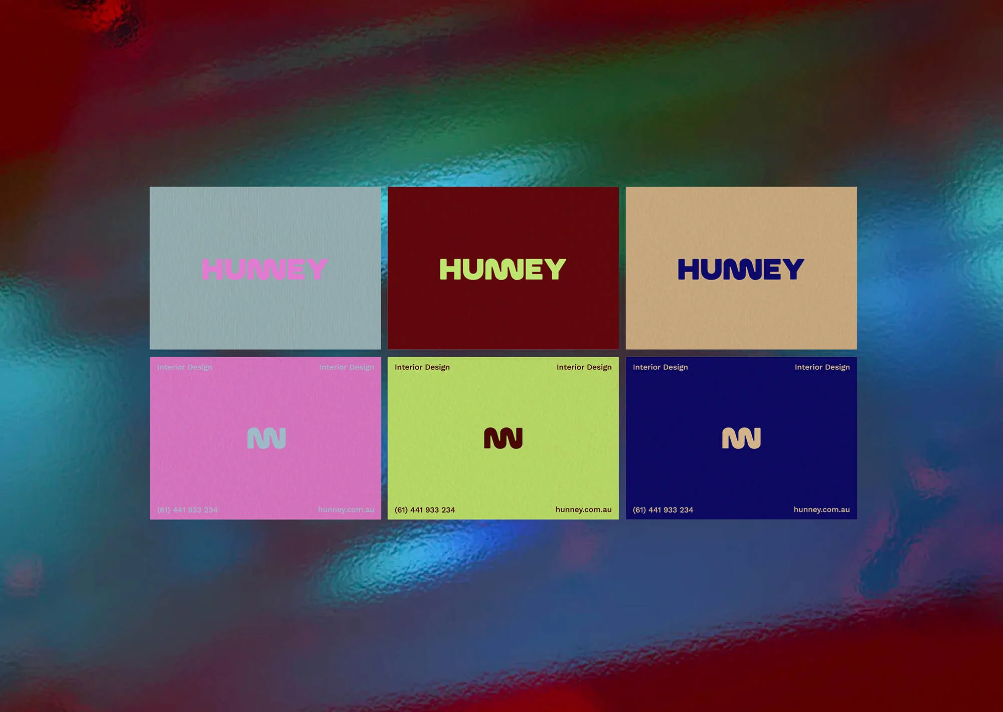 Promotional image featuring business card designs for Hunney Interior Design in various color palettes on a textured background.