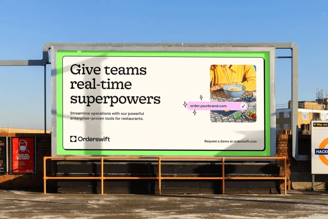 Orderswift billboard in an urban setting showcasing real-time superpowers for restaurant teams, promoting a demo at orderswift.com.