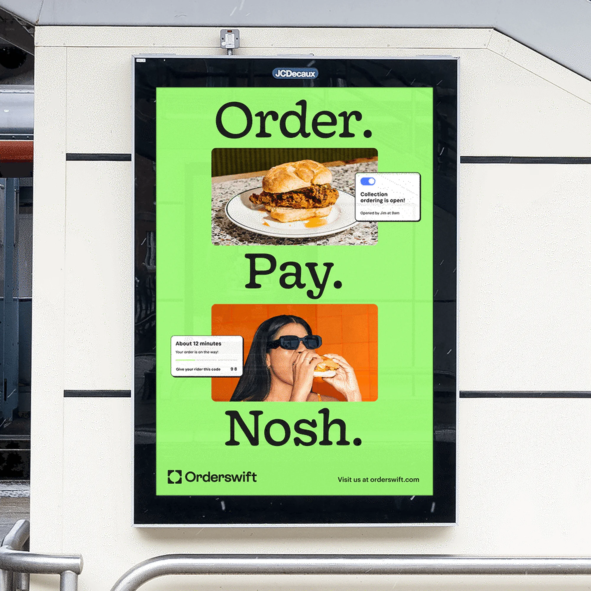 Outdoor advertising billboard displaying a food order app promotion with a sandwich image and a woman eating a burger against a green background.