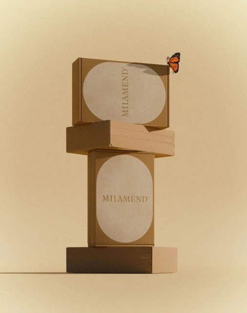 A stack of brown cardboard boxes, labeled 'MILAMEND,' is set against a cream-colored background, and an orange butterfly rests on the top box.