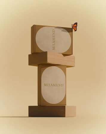 A stack of brown cardboard boxes, labeled 'MILAMEND,' is set against a cream-colored background, and an orange butterfly rests on the top box.