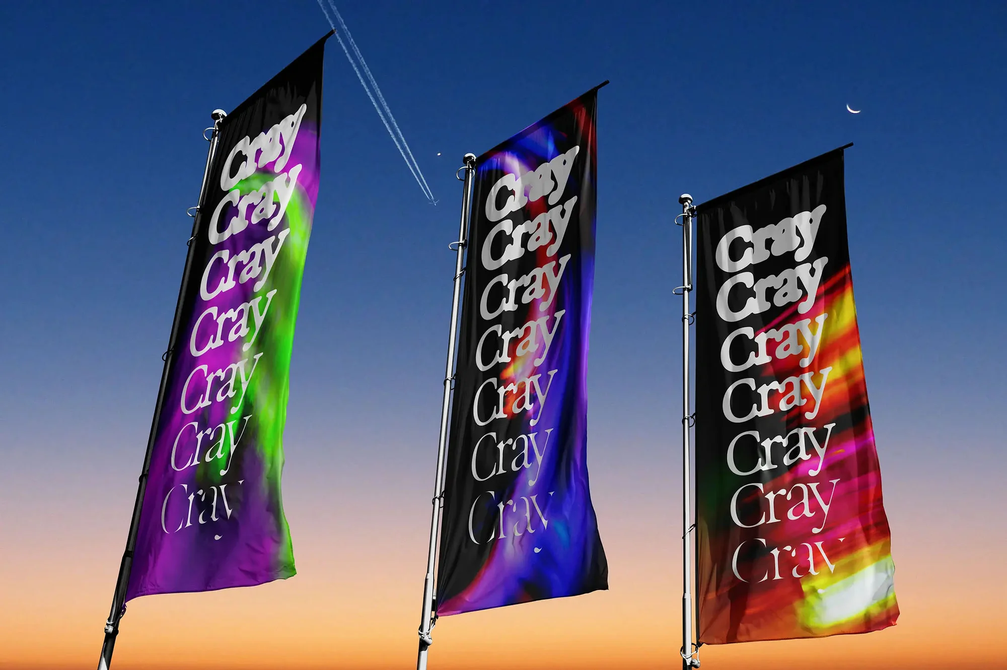 Three vertical advertising flags with the text 'Cray' against a blue sky during a sunset, with contrails from an airplane in the background.