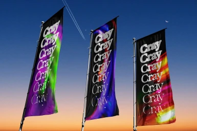 Three tall black vertical flags featuring repeating Cray branding set against a gradient dusk sky with vapour trails