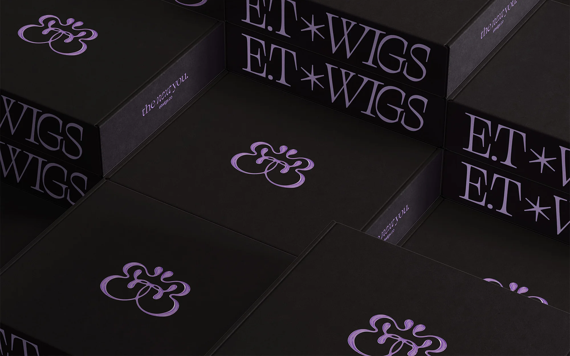Stacks of black boxes with brand logos and text labels are arranged diagonally, creating a geometric pattern. 