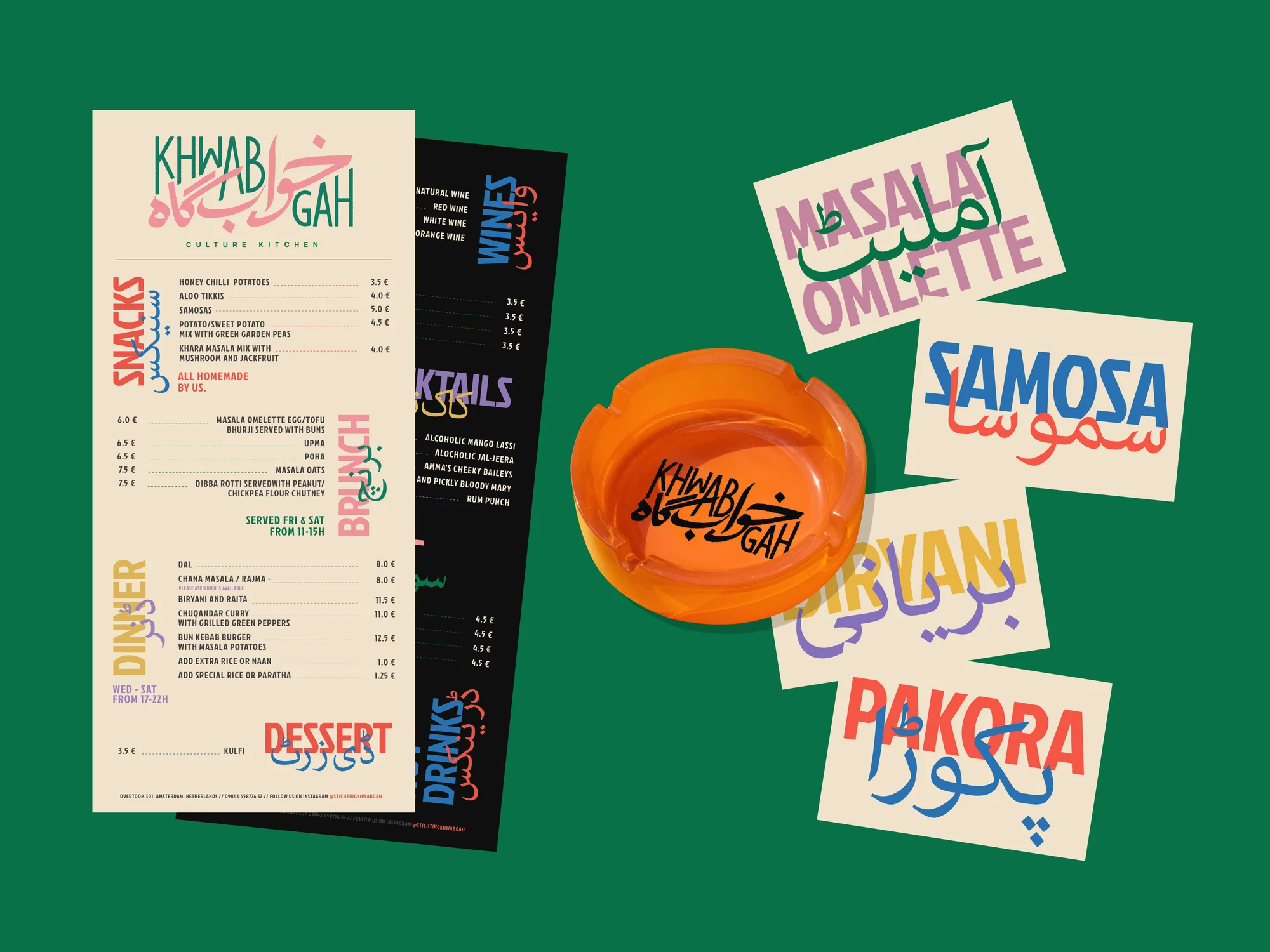 Overhead shot of a restaurant menu, an orange ashtray, and food names written on separate pieces of paper on green background.