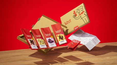 Mui Coffee Roastery brand packaging featuring red coffee bags, cardboard boxes, and leaflets floating above a wooden surface against a red backdrop