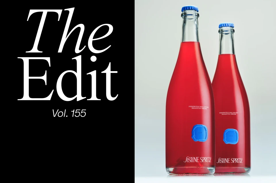 Two elegant bottles of Sistine Spritz stand against a soft white backdrop, featuring clear glass, red liquid, and a bold black text overlay.
