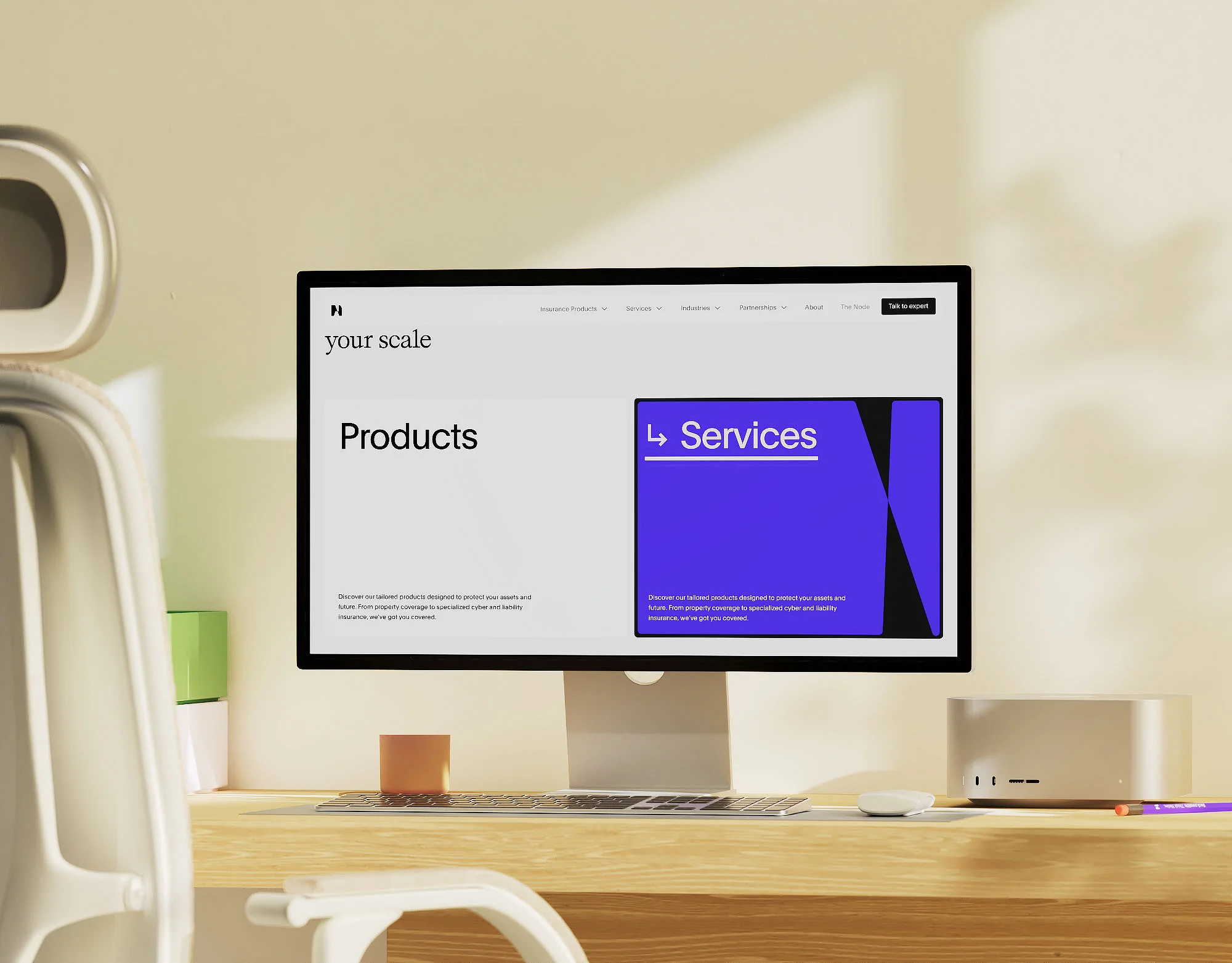Computer monitor displaying website interface with 'Products' and 'Services' headings, keyboard, desk, and office chair in minimal setting.