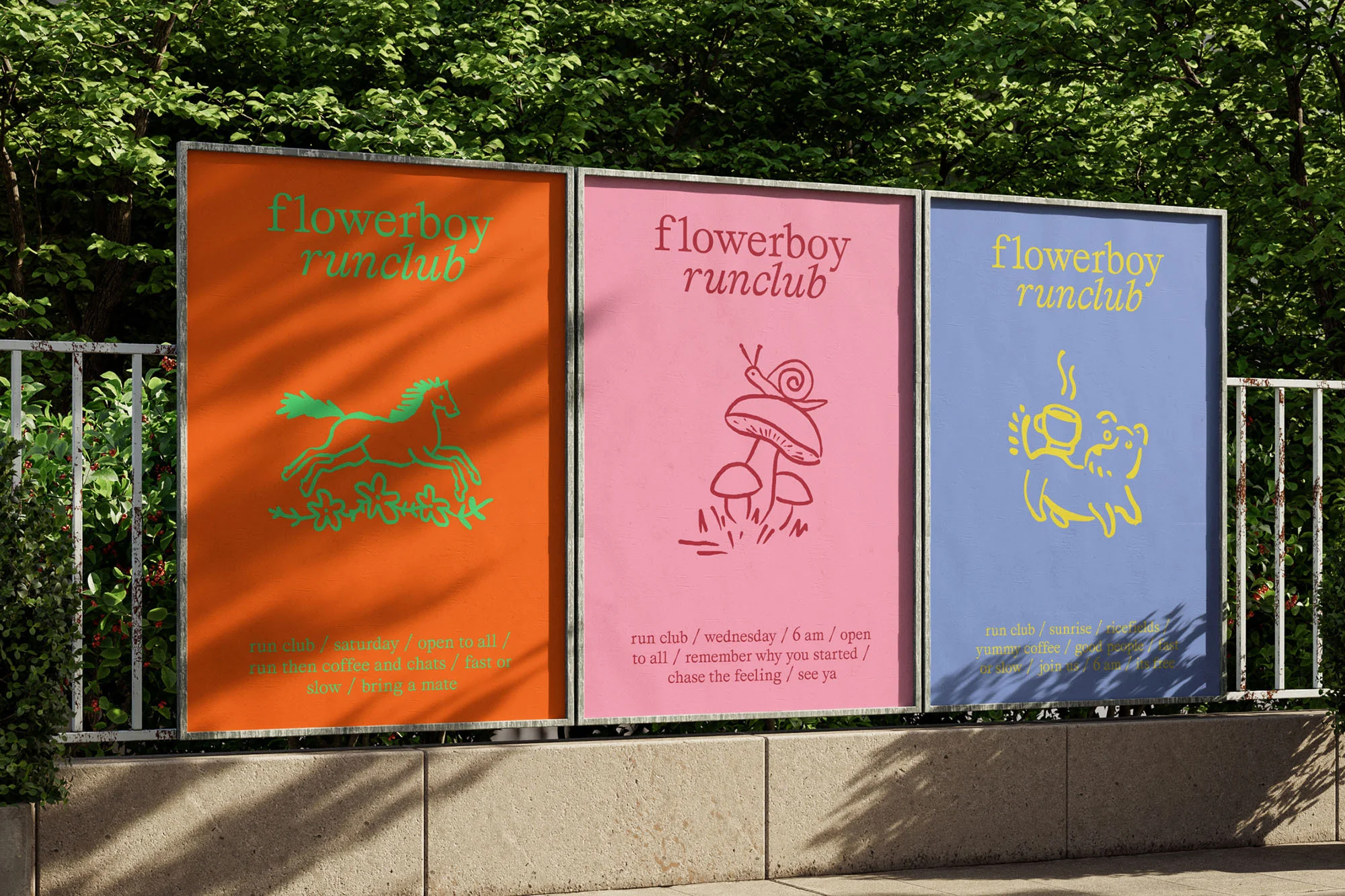 Three colourful 'flowerboy runclub' poster designs displayed outdoors, featuring unique illustrations and event information.