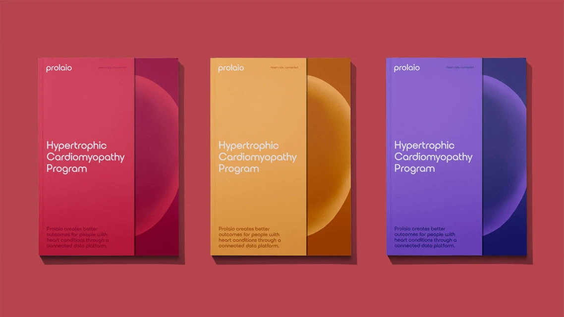 Three Prolaio Hypertrophic Cardiomyopathy Program booklets in red, yellow, and purple on a matching background. Product marketing.