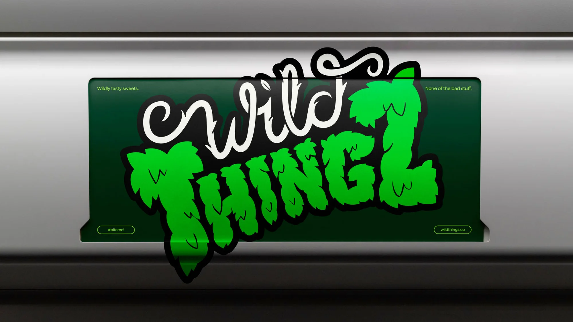 Green and white 'Wild Thing' logo art with leaf details, sticker style on a sleek gray background, bold design and playful typography.
