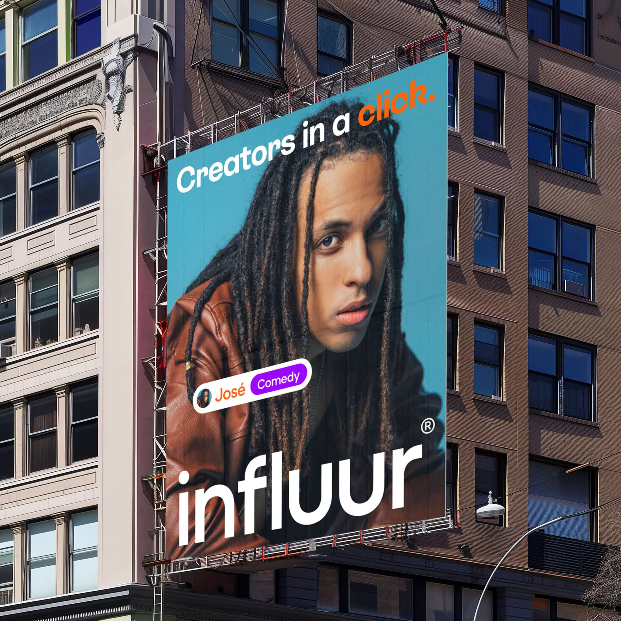 Billboard advertisement on a building featuring a man with dreadlocks and the text 'Creators in a click' and 'Influur' on a building.