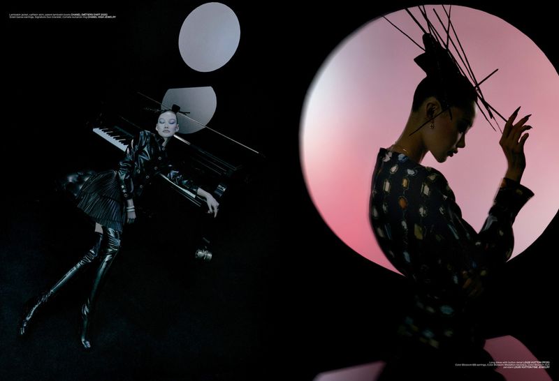 Fashion editorial shot of a woman in black leather posing with a piano, contrasted by a woman's silhouette against a pink background.