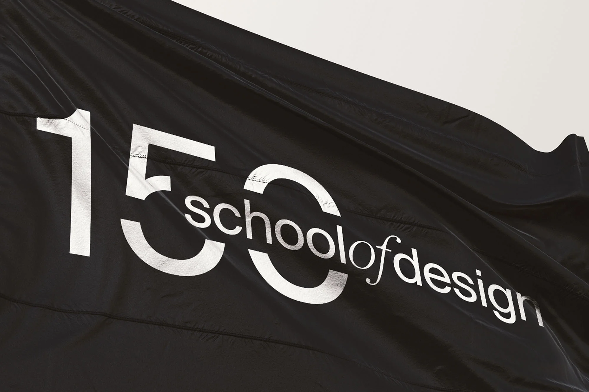 Black flag with the white text '150 school of design', suggesting a design school's anniversary or branding material.