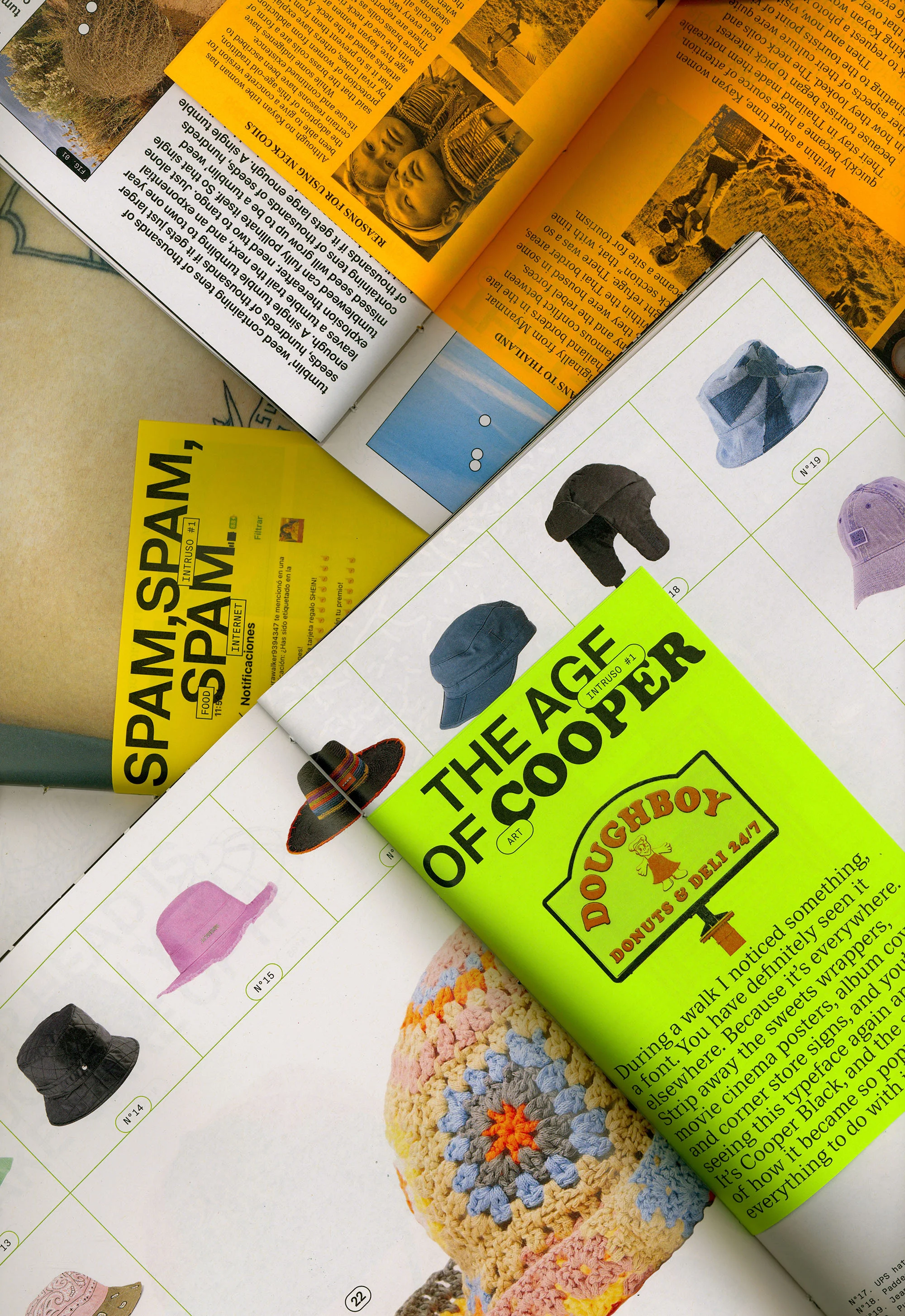 Overhead shot of magazine pages and a chartreuse book featuring hats, graphic design and typography elements, with a vibrant aesthetic.