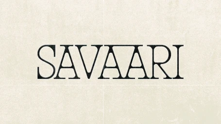 Text-based brand identity logo reading Savaari in serif typography against a textured cream background.