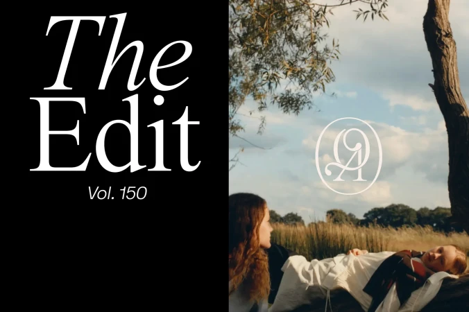Split-screen shows a magazine cover on the left and two women in a field on the right, under trees and a blue sky with clouds.