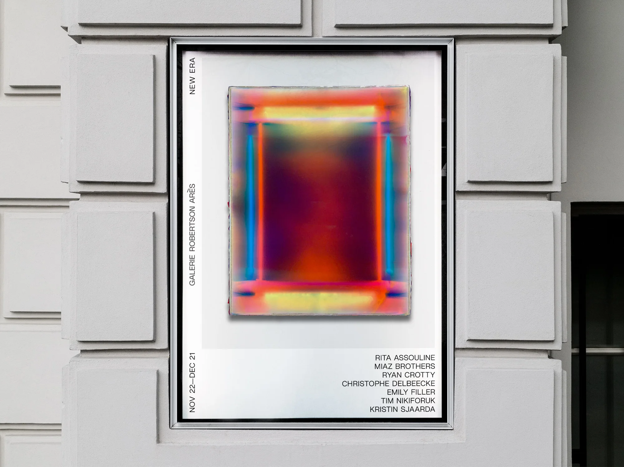Street art poster featuring a colorful abstract painting in a white frame mounted on a light gray wall in an outdoor urban setting.