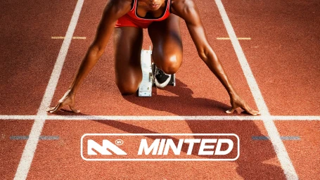 Athlete in starting blocks on a running track with Minted brand logo overlay