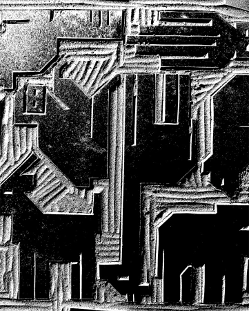 Abstract architectural carving in shades of black and white, featuring geometric shapes and textured surfaces with distinct lines and shadows.