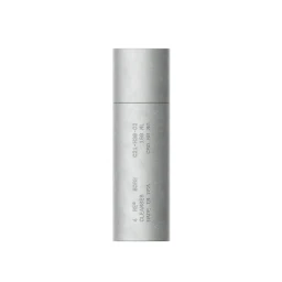 Cylindrical silver skincare bottle with debossed product typography on a plain white background