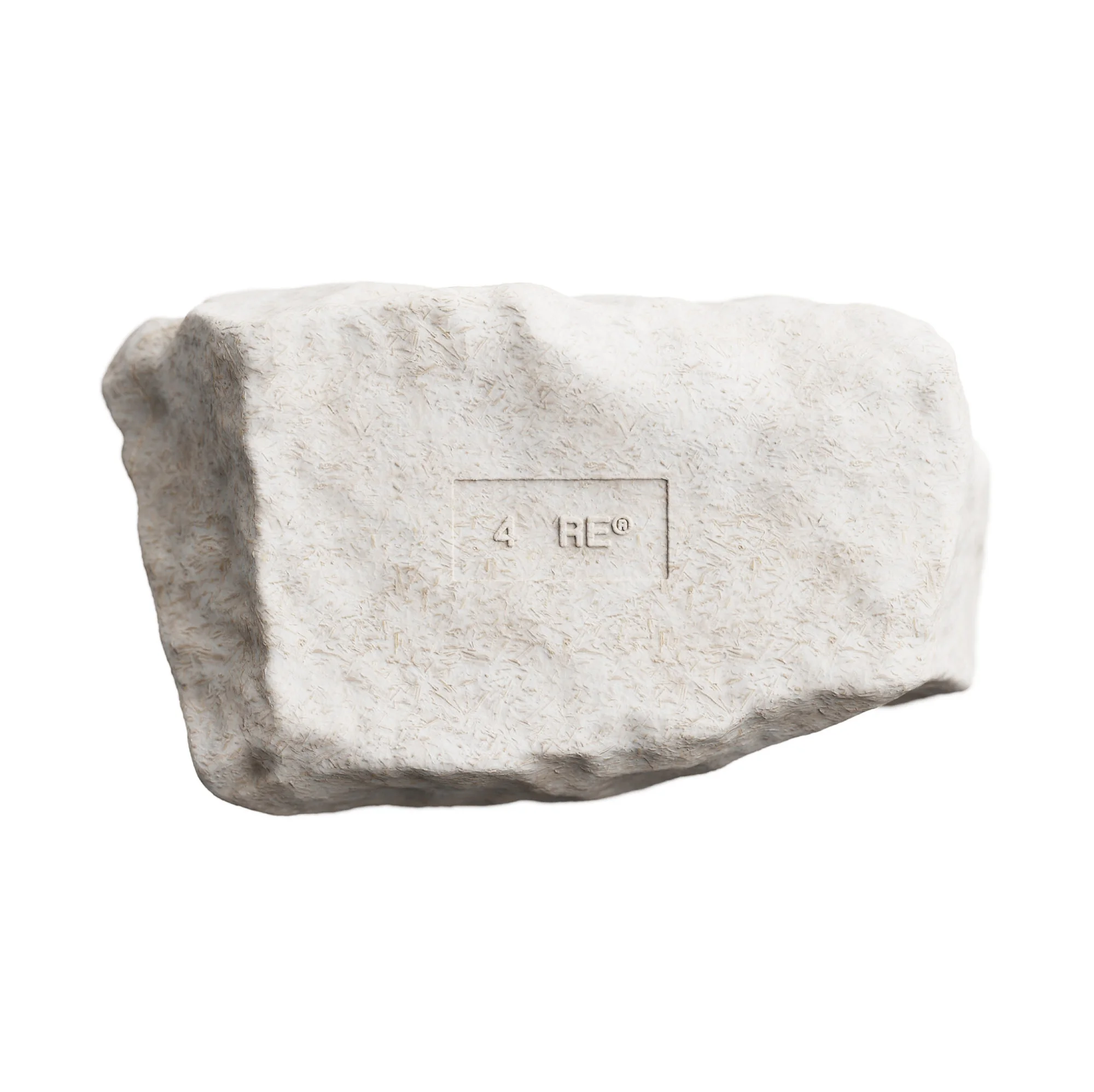 Close-up studio shot of a white-grey stone block featuring subtle carved texture and etched text on a neutral background.