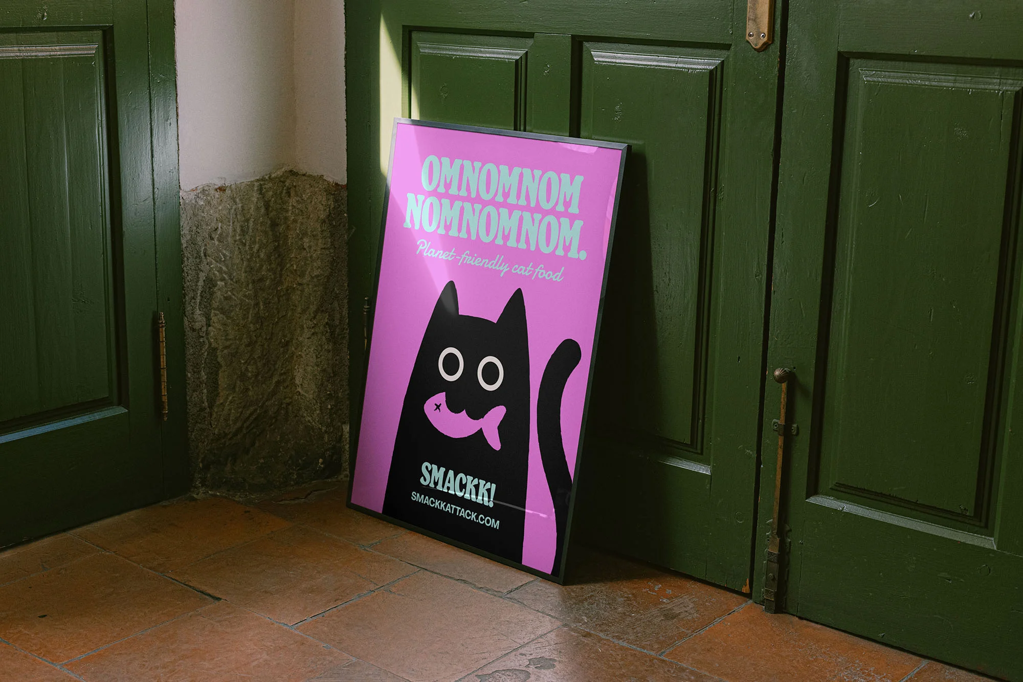 Pink poster of a cat holding a fish in its mouth leaning against a green door, advertising planet-friendly cat food from Smackkattack.