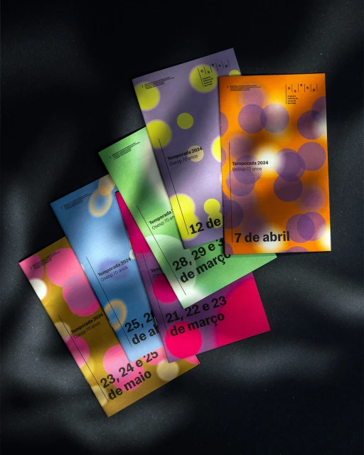 Colorful graphic design event posters with blurred circles overlap on dark background, advertising dates in March, April, and May.