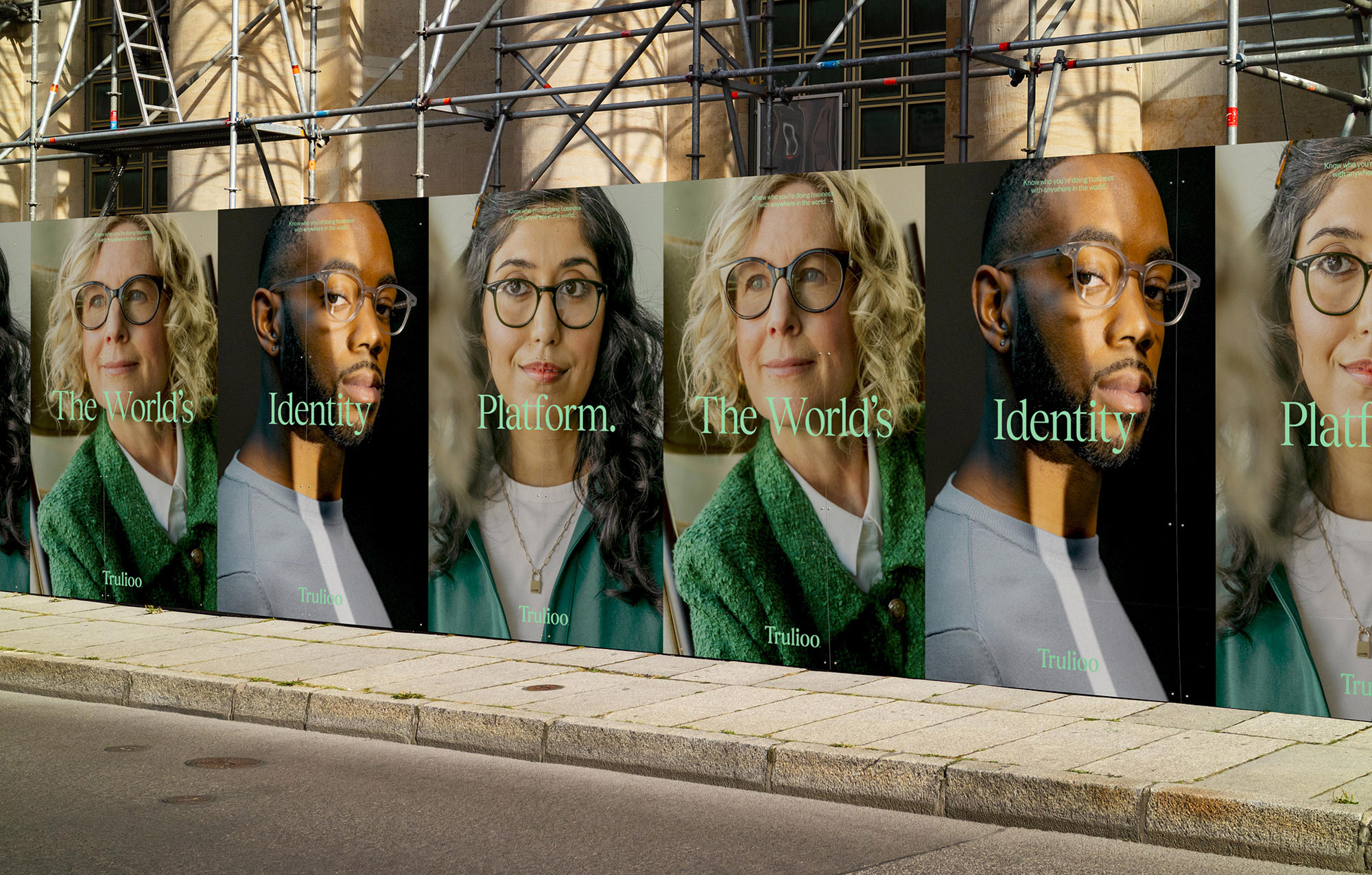 Outdoor advertising features diverse adults wearing glasses on a city street, promoting a brand identity platform.