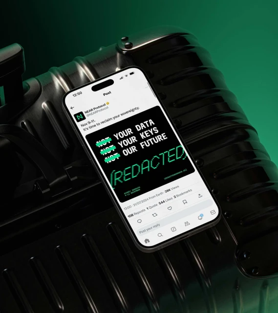 Smartphone displays a tweet about data sovereignty, resting on a black textured suitcase against a dark green background, highlighting digital rights.
