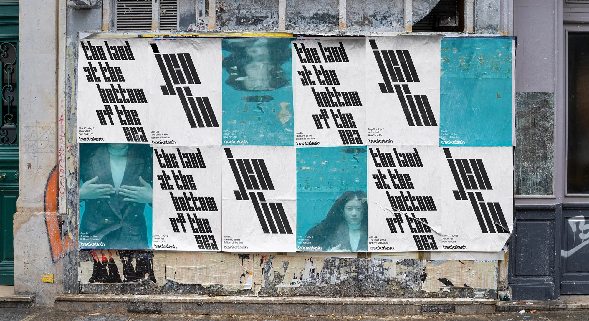 Outdoor posters on a building feature typography and portrait art, mounted to textured walls in an urban environment, daylight.