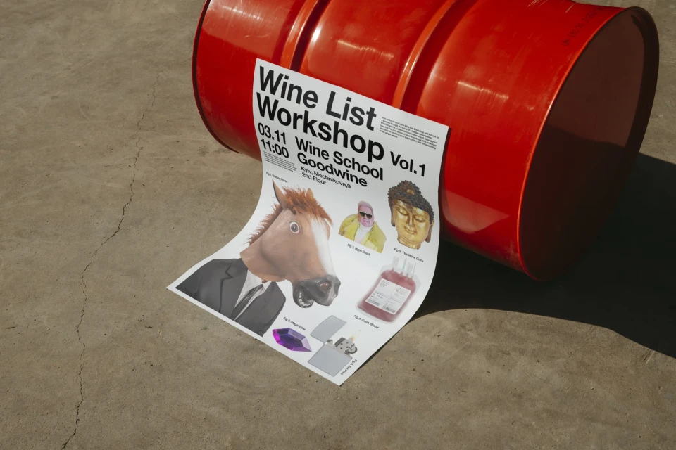 Artistic wine workshop flyer featuring horse-headed person, Buddha head, and gemstone, placed near an industrial barrel on concrete.