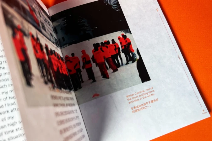 A magazine shows photos of people wearing orange jackets in a snowy outdoor setting. The article mentions a winter carnival.