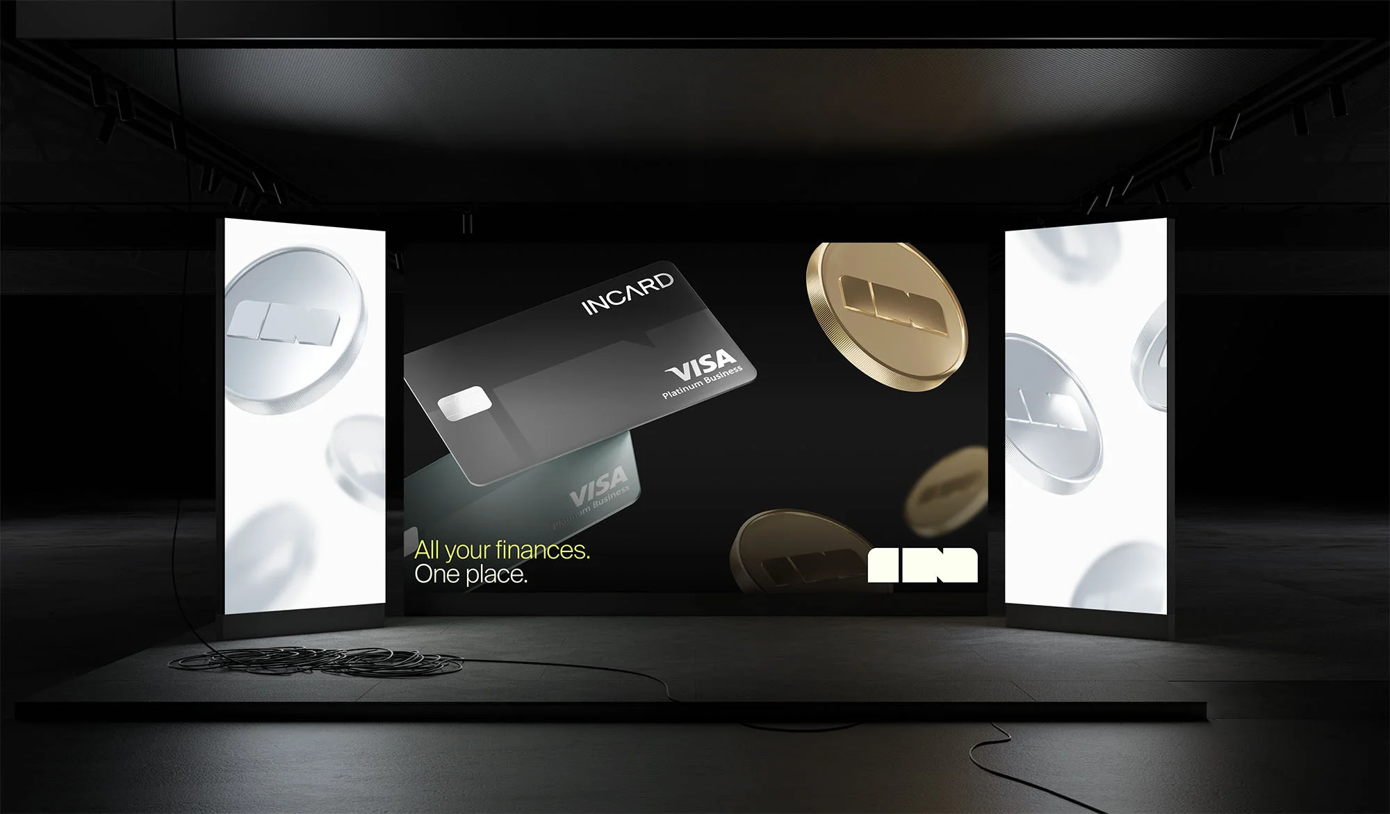 Digital display of a black InCard Visa Platinum Business credit card with flying coins in a dark studio setting on a grey surface.