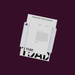 TOAD brand identity stationery set with letterhead and typography on a dark background