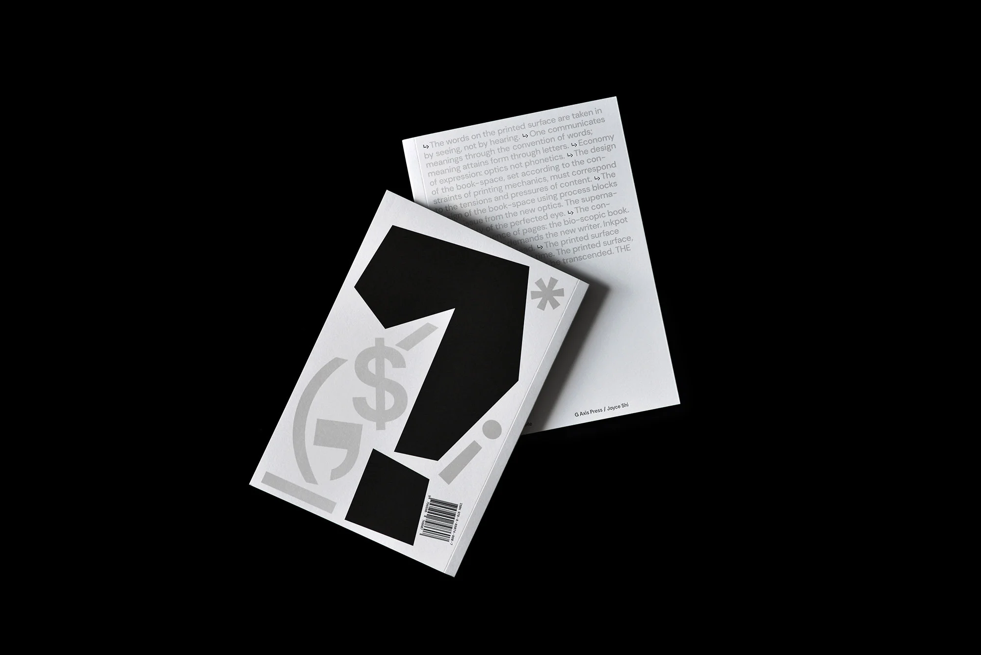 Close-up of white graphic design book cover with black question mark and dollar sign on a black background, promoting visual creativity.