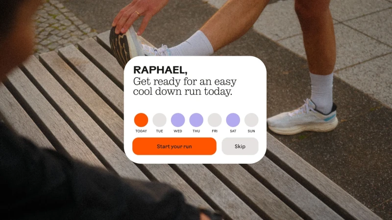 A person stretches a leg on a wood bench while using a smartphone app that motivates running with a daily plan for an easy cool down.