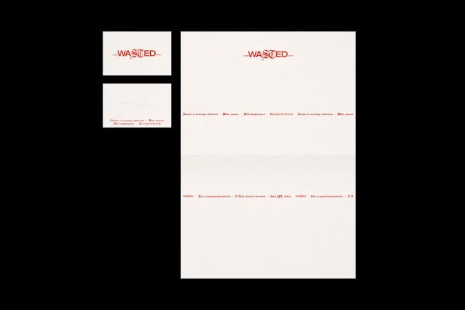 Promotional design featuring 'Wasted' in red script on white paper, displaying branding and printed text layout for marketing material.