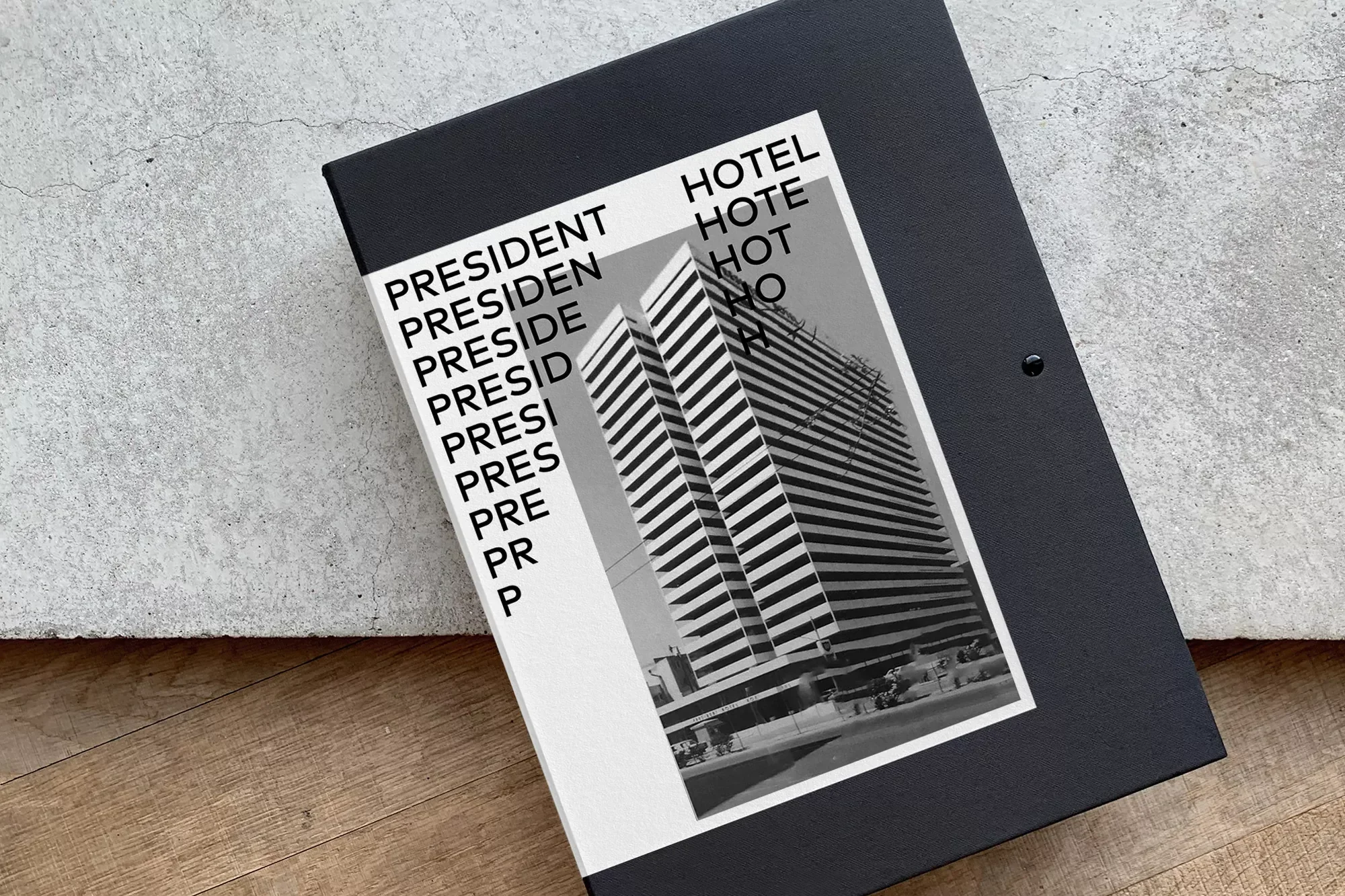 Black book cover featuring a black and white building photograph with the word 'PRESIDENT' and 'HOTEL' in bold, sans-serif font.