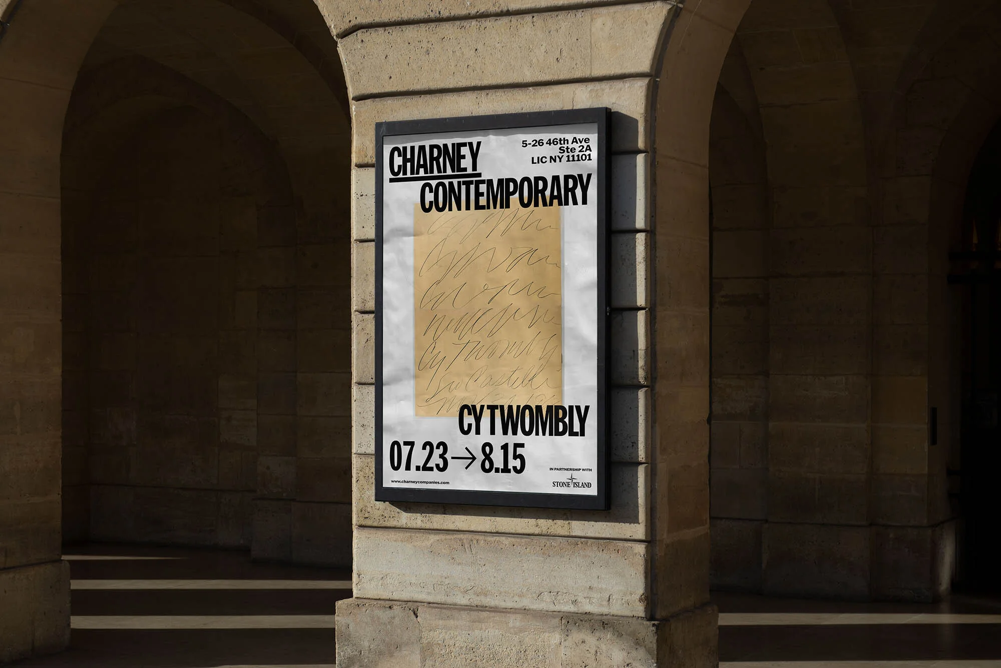 Framed poster for the Cy Twombly exhibition at Charney Contemporary gallery displayed on an exterior stone wall of an archway.