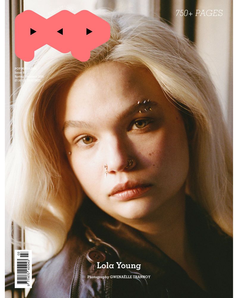 Magazine cover featuring a young adult with blonde hair, nose piercings, and a black leather jacket, framed against a neutral background.