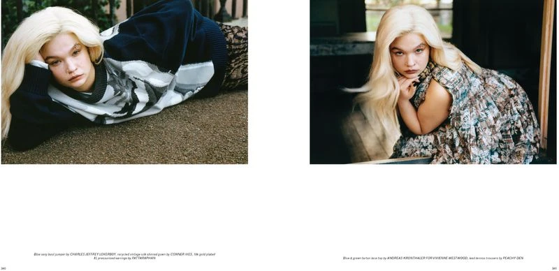 Young woman with platinum blonde hair poses in a studio wearing a patterned dress and black jumper. Fashion editorial shot.