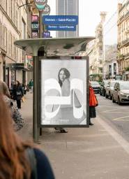 Bus shelter advertising display in a city street showing a monochrome brand campaign poster for Hercule Studio.