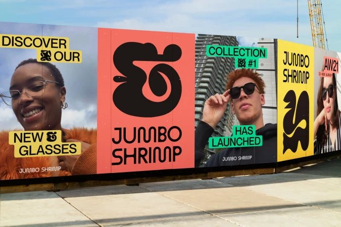 Eye-catching billboard featuring eyewear ad, showcasing Jumbo Shrimp brand with diverse models and bold, colorful graphics.