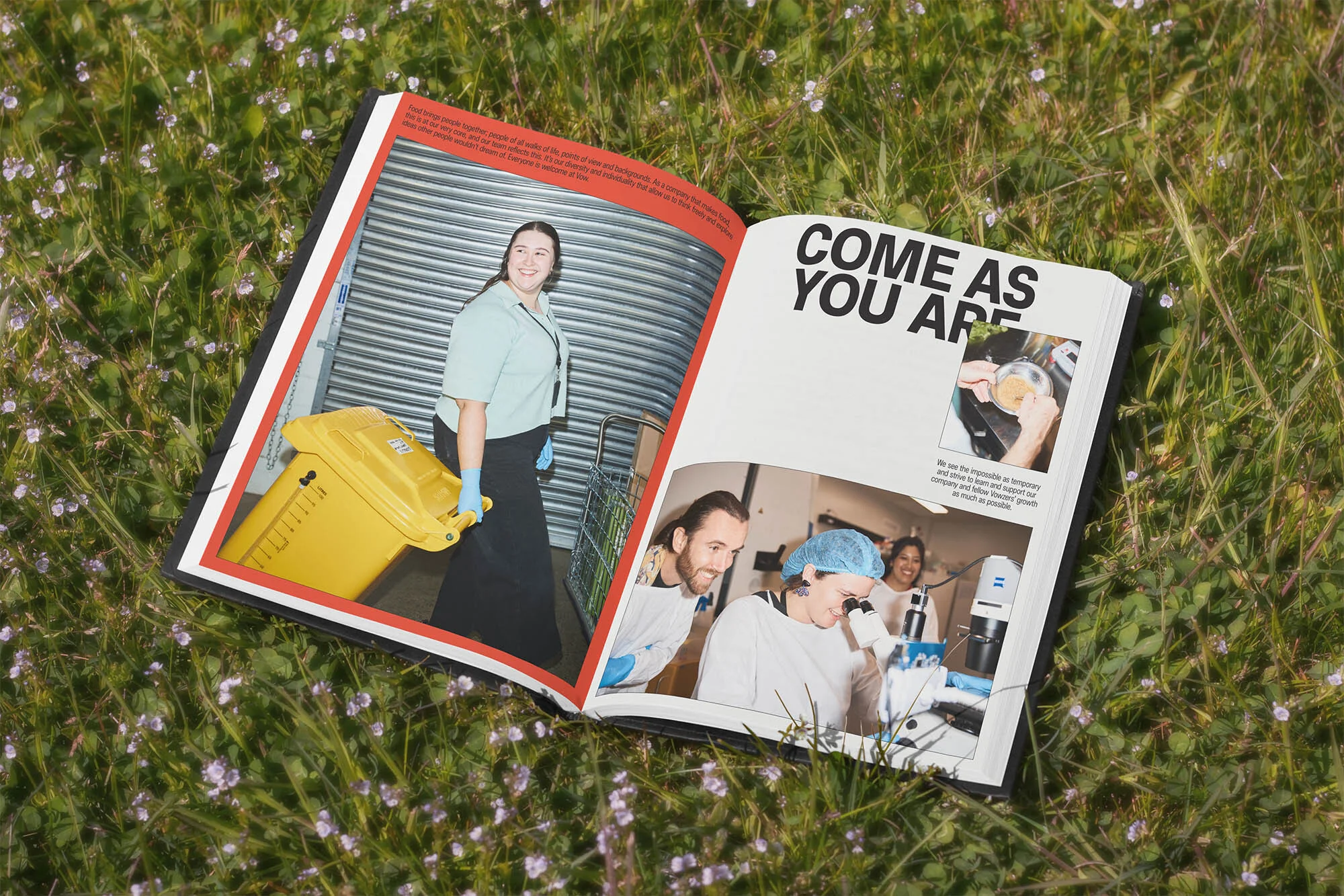 Open book on green grass shows smiling woman with yellow trash bin and scientists in lab, with headline "Come as you are."
